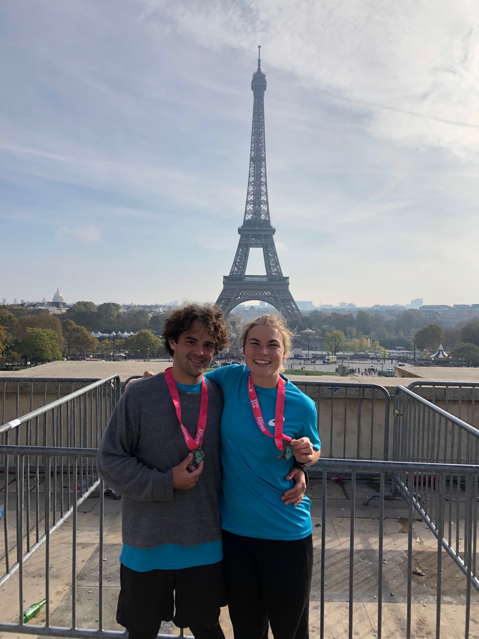 Sye and I in front of the Eiffel Tower with our medals